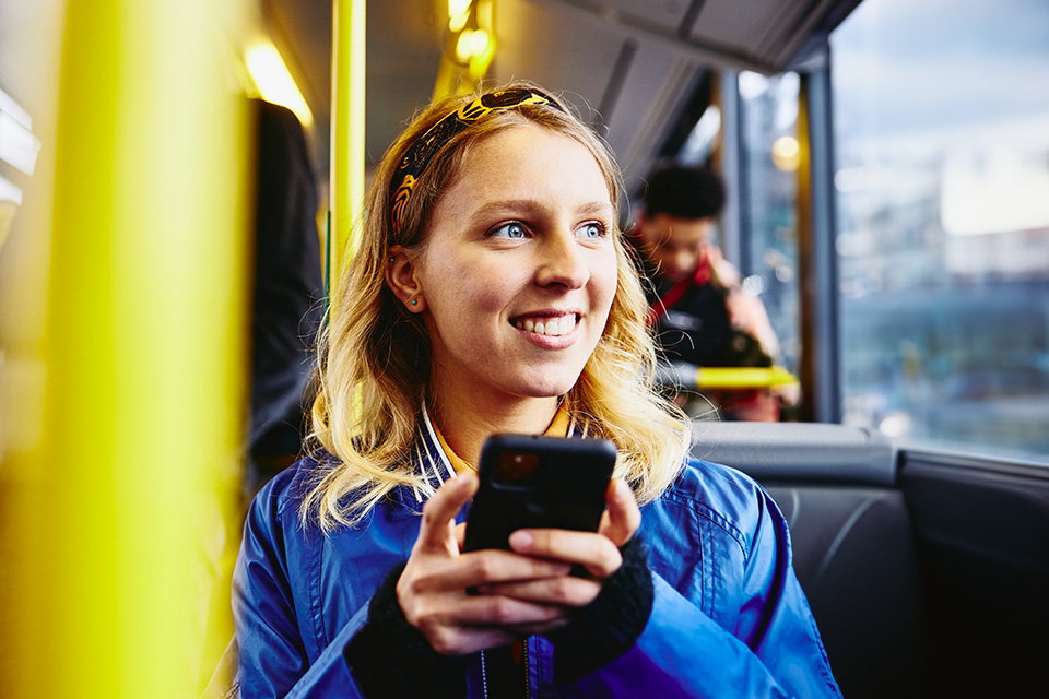 woman in bus on mobile