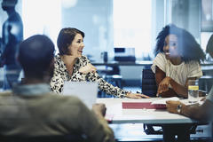 People around a meeting table.