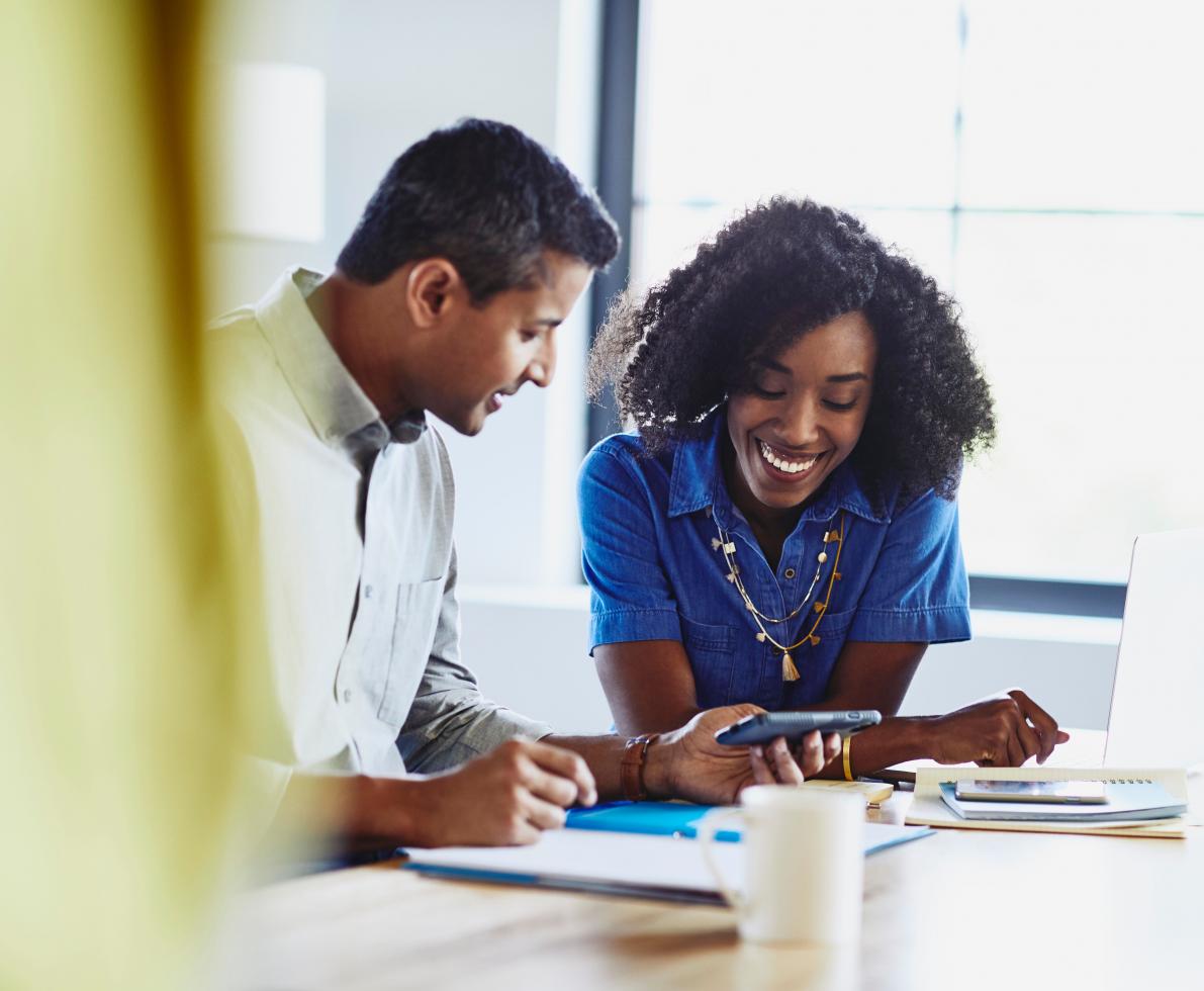 photo of man and woman working together