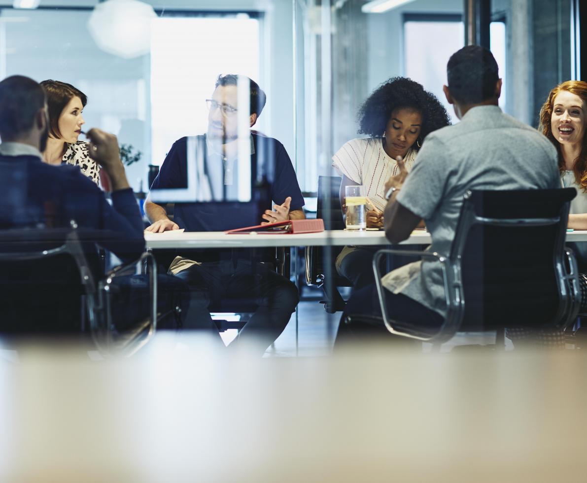 6 people in a meeting room