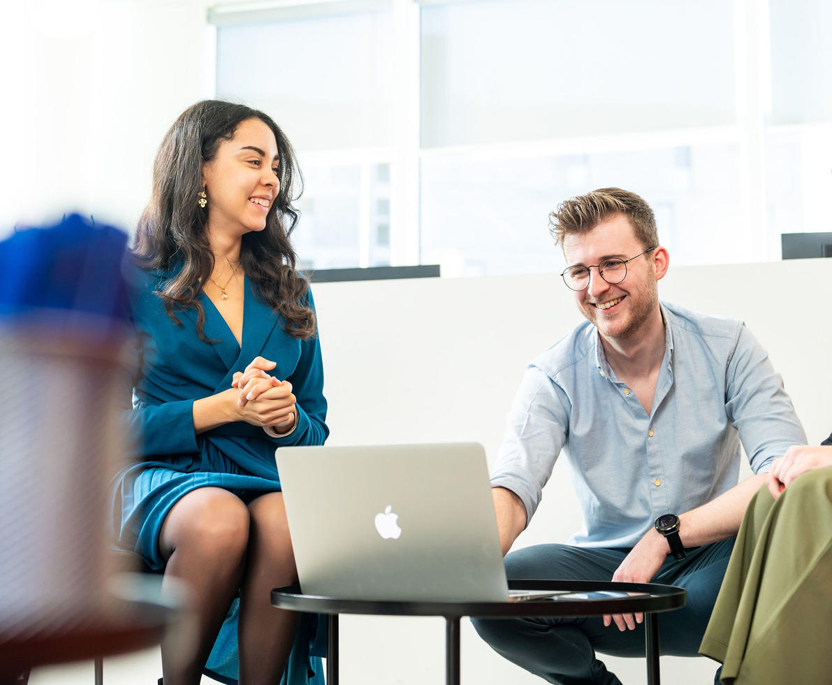 Photo of 3 people having an informal meeting.